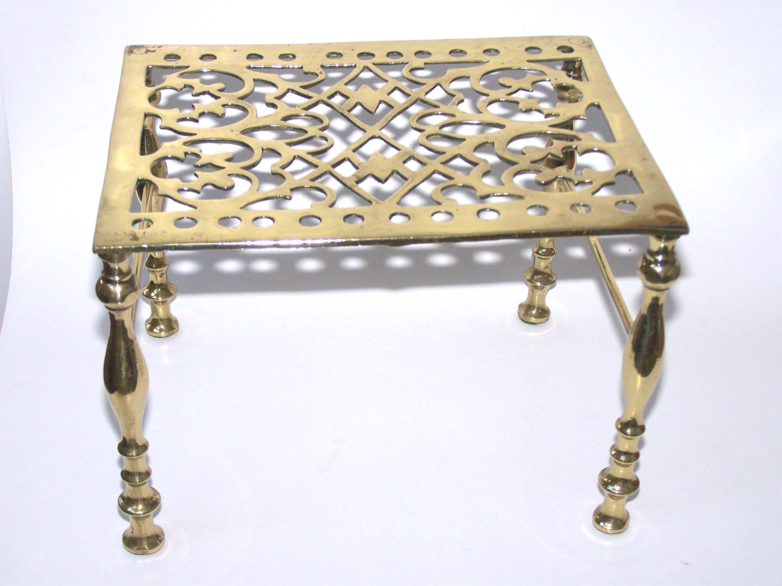A Charming small Victorian brass Trivet circa 1860